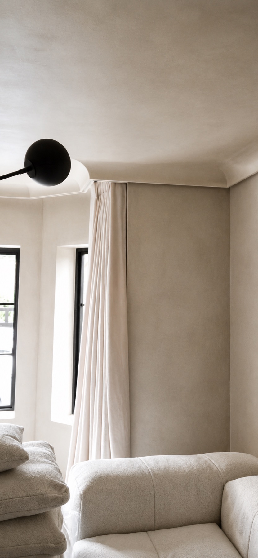 Neutral interior with full-height bespoke curtains